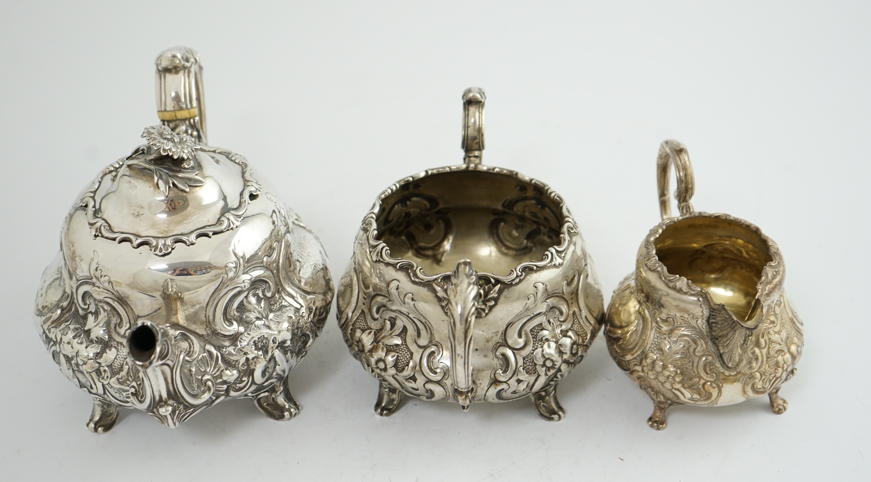 A matched Victorian and later silver three piece tea set